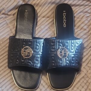 Bebe Black and Gold Embossed Slide Sandals
